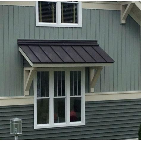 metal.clips above.exterior windows of old house|cement bars above windows.